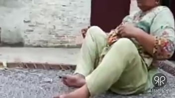 Sizzling Desi Aunty Puffs On A Smoke With Seductive Style