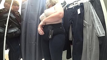 Curvaceous Mature Beauty Caught On Hidden Cam In Public Changing Room, Her Luscious Ass Barely Contained By White Panties And Full Breasts Swelling From Her Bra.