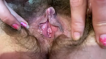 Extreme Close-up Of A Thick, Bushy Pussy With A Swollen Clit Being Rubbed And Fingered In Intense Solo Play