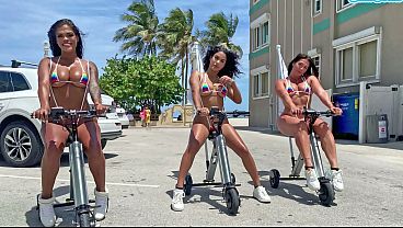 Voluptuous Latinas Flaunt Their Curves On Electric Trikes At The Beach