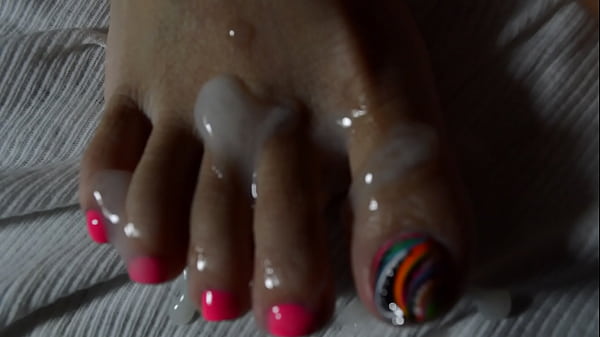 Sole-soaked Seduction: A Glossy Finish On Her Exotic Toes